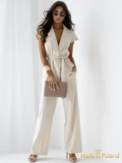 Komplety Damskie^Royalfashion Aurelia Milano – kombinezon damski z tkaniny z dekoltem w serek beżowy