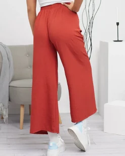 Spodnie Materiałowe^Royalfashion Damskie szerokie spodnie palazzo w kolorze m- Odzież czerwony