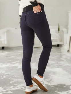 Jeansy^Royalfashion Bawełniane jeansy damskie typu rurki Granatowy