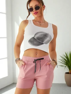 Szorty|Krótkie Spodenki^Royalfashion Bawełniane krótkie spodenki damskie z gumką i troczkami w pasie Jasnoróżowy