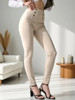 Spodnie Materiałowe|Legginsy / Tregginsy^Royalfashion Bawełniane spodnie typu tregginsy damskie z ozdobnymi guzikami beżowy