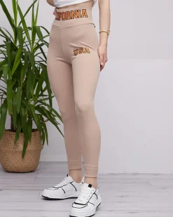 Legginsy / Tregginsy^Royalfashion Beżowe damskie prążkowane legginsy z pomarańczowymi napisami jasny brązowy