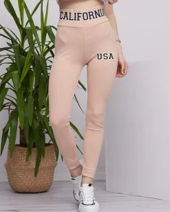 Legginsy / Tregginsy^Royalfashion Beżowe damskie prążkowane legginsy z napisami beżowy