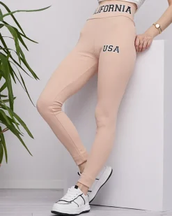 Legginsy / Tregginsy^Royalfashion Beżowe damskie prążkowane legginsy z napisami beżowy