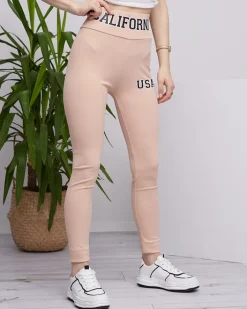 Legginsy / Tregginsy^Royalfashion Beżowe damskie prążkowane legginsy z napisami beżowy