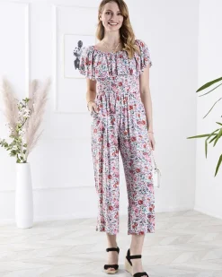 Kombinezony^Royalfashion Biało- długi kombinezon damski w kwiaty różowy