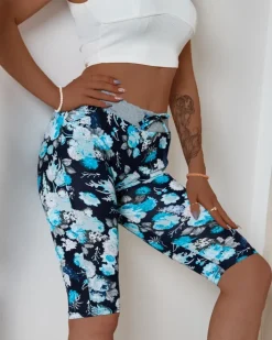 Spodenki 3/4|Krótkie Spodenki^Royalfashion Ciemnoniebieskie damskie spodenki 3/4 z kwiatowym wzorem Ecru