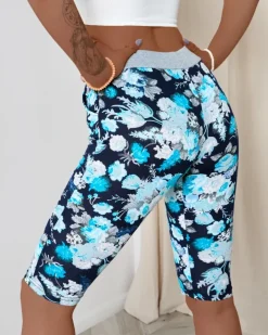 Spodenki 3/4|Krótkie Spodenki^Royalfashion Ciemnoniebieskie damskie spodenki 3/4 z kwiatowym wzorem Ecru