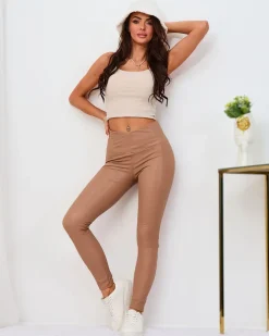 Legginsy / Tregginsy^Royalfashion Damskie eko-skórzane ocieplane legginsy w m kolorze beżowy