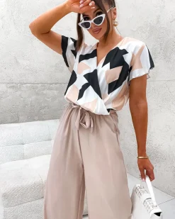 Kombinezony^Royalfashion Długi kombinezon damski z printem beżowy