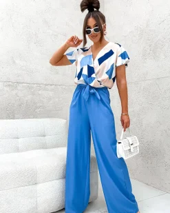 Kombinezony^Royalfashion Długi kombinezon damski z printem Ecru