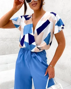 Kombinezony^Royalfashion Długi kombinezon damski z printem Ecru