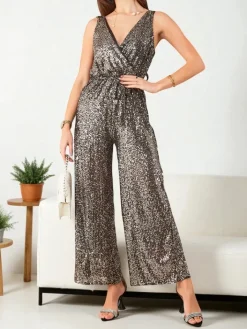 Kombinezony^Royalfashion Długi kombinezon damski z cekinami złoty