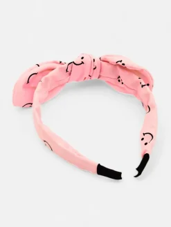 Akcesoria Do Włosów^Royalfashion Dziecięca opaska do włosów z kokardką z printem w uśmiechnięte buźki różowy