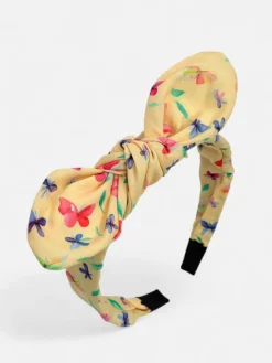 Akcesoria Do Włosów^Royalfashion Dziecięca opaska do włosów z kokardką z printem żółty