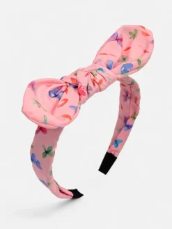 Akcesoria Do Włosów^Royalfashion Dziecięca opaska do włosów z kokardką z printem różowy