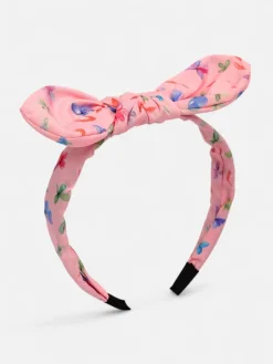 Akcesoria Do Włosów^Royalfashion Dziecięca opaska do włosów z kokardką z printem różowy