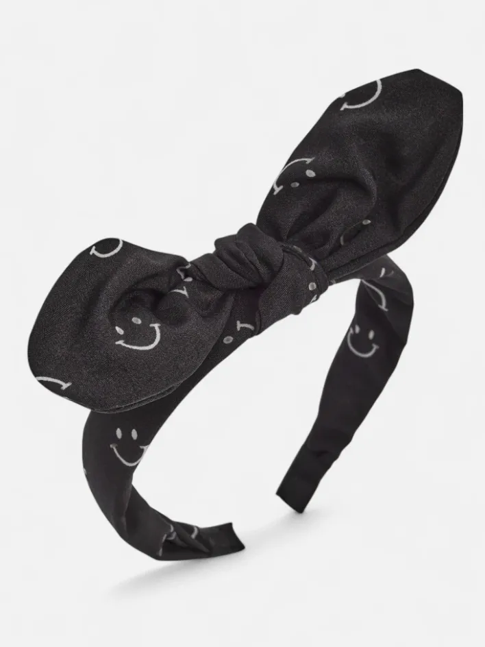 Akcesoria Do Włosów^Royalfashion Dziecięca opaska do włosów z kokardką z printem w uśmiechnięte buźki czarny