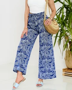 Spodnie Materiałowe^Royalfashion Granatowe damskie spodnie materiałowe z printem Granatowy