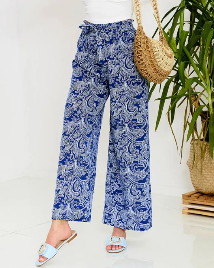 Spodnie Materiałowe^Royalfashion Granatowe damskie spodnie materiałowe z printem Granatowy