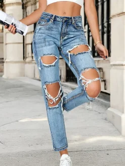 Jeansy^Royalfashion Jeansy damskie rurki z przetarciami