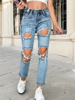 Jeansy^Royalfashion Jeansy damskie rurki z przetarciami