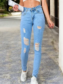 Jeansy^Royalfashion Jeansy damskie typu rurki z przetarciami 5717-6