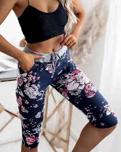 Spodenki 3/4|Krótkie Spodenki^Royalfashion Spodenki damskie granatowo- różowe o długości 3/4 Granatowy