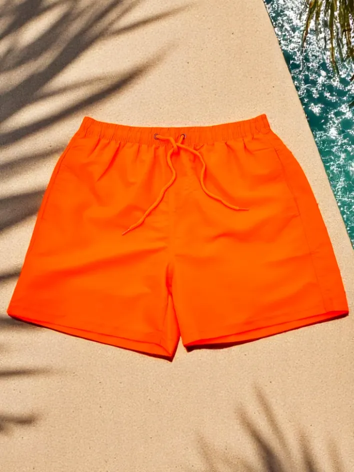 Spodnie^Royalfashion Sportowe męskie krótkie spodenki z ochronną siateczką pomarańczowy