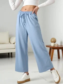 Spodnie Materiałowe|Spodnie Dresowe^Royalfashion Wiskozowe szerokie spodnie damskie dresowe Ecru