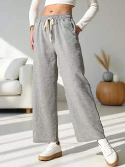 Spodnie Materiałowe|Spodnie Dresowe^Royalfashion Wiskozowe szerokie spodnie damskie dresowe z cyrkoniami gołębi szary