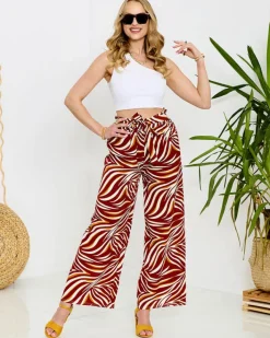 Spodnie Materiałowe^Royalfashion Wzorzyste spodnie damskie typu palazzo w kolorze m czerwony