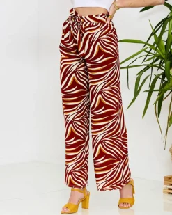 Spodnie Materiałowe^Royalfashion Wzorzyste spodnie damskie typu palazzo w kolorze m czerwony