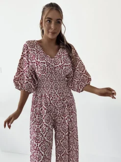 Kombinezony^Royalfashion Wzorzysty kombinezon damski różowy