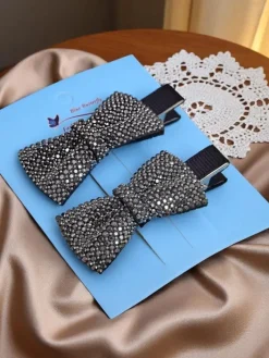 Akcesoria Do Włosów^Royalfashion Zestaw 2 spinek do włosów z kokardkami z cyrkoniami Isadora srebrny